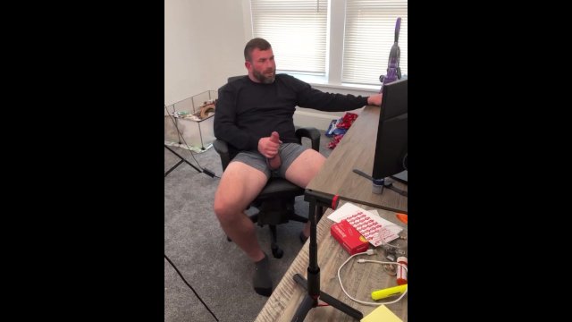 Stroking thick cock to porn.
